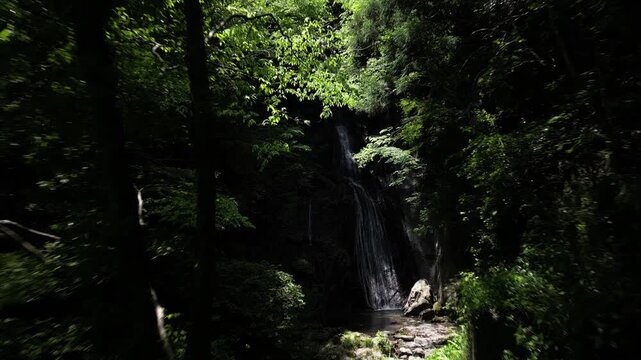 Sunlit Kanjou Falls in Mima, Tokushima, Japan &ndash; Aerial Drone View of a Waterfall Illuminated by Sunlight Filtering Through the Forest
