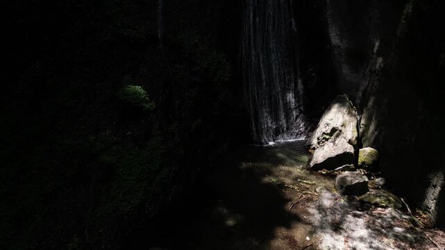 Sunlit Kanjou Falls in Mima, Tokushima, Japan &ndash; Aerial Drone View of a Waterfall Illuminated by Sunlight Filtering Through the Forest
