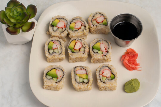brown  rice sushi   served with soy sauce and wasabi