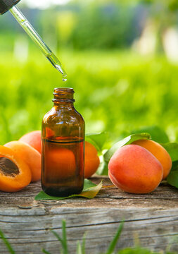 Apricot kernel oil in a bottle. Selective focus.