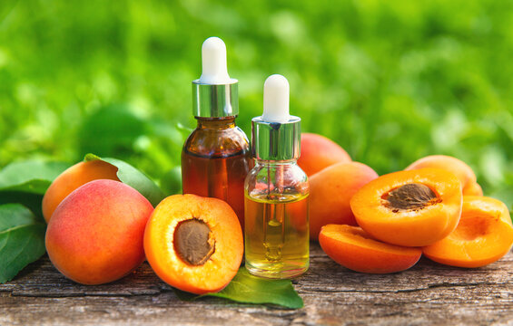 Apricot kernel oil in a bottle. Selective focus.