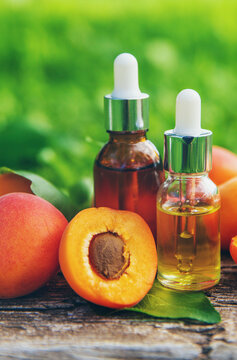 Apricot kernel oil in a bottle. Selective focus.