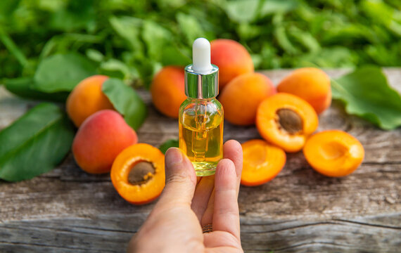 Apricot kernel oil in a bottle. Selective focus.