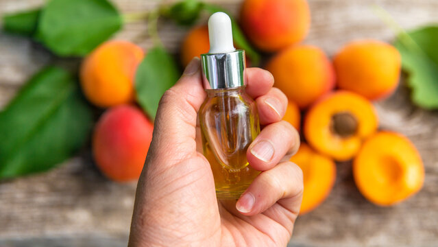 Apricot kernel oil in a bottle. Selective focus.