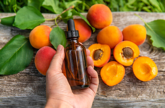 Apricot kernel oil in a bottle. Selective focus.