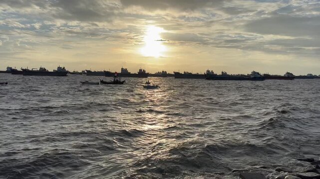 Cargo Ships Anchored Off Chittagong Port at Sunset in Bangladesh