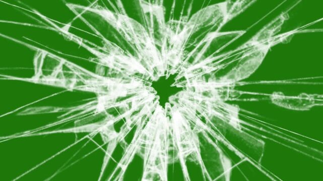 footage of broken glass, with a green screen in the background.	
