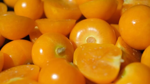 Macro texture of fresh golden berries physalis showing inner seeds and juicy flesh