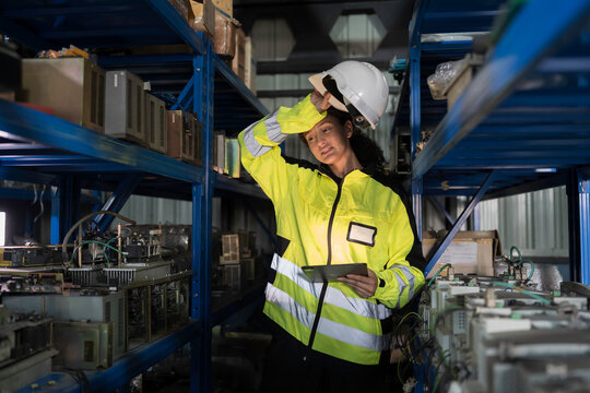 Woman worker working feeling tired, exhausted from work and air not ventilated in warehouse
