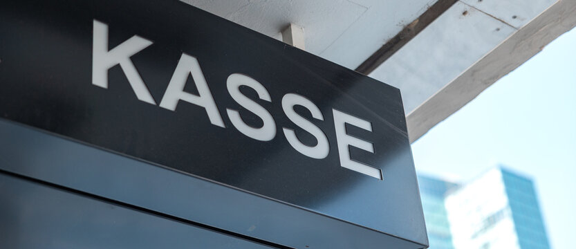 Kasse - cash register symbol at the entrance to a building. Paying admission to a theater, movie theater, nightclub, museum, or public facility.