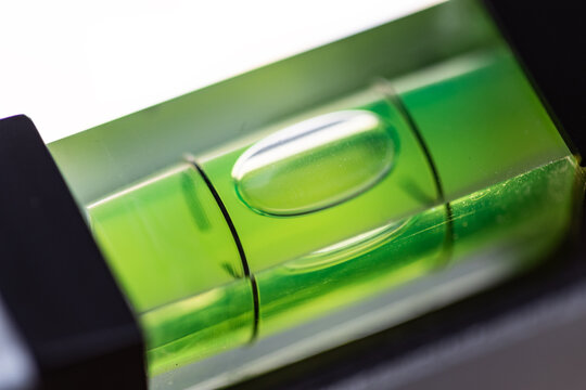 Close-up of a spirit level that is balanced. Accuracy, scale, handyman work tool, craftsman, construction industry, or carpentry.