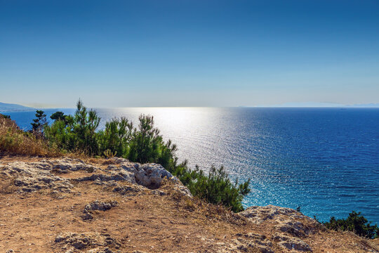 Wide panorama of a glittering blue Mediterranean Sea view from Monte Smith Hill with sun reflecting on water in Rhodes