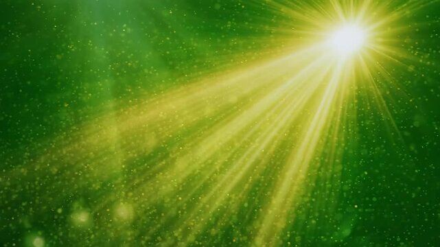 Golden light beams emanating from above with lens flare on black background transitioning to green