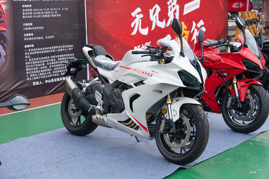 ZhongShan GuangDong China-April 11 2026: QJMOTOR 600RS white sport supersport motorcycle displayed on outdoor exhibition venue.