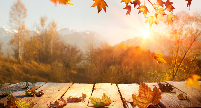 Autumn Table - Yellow Leaves With Sunlight And Wooden Plank - Sunshine Effect And Abstract Bokeh Light