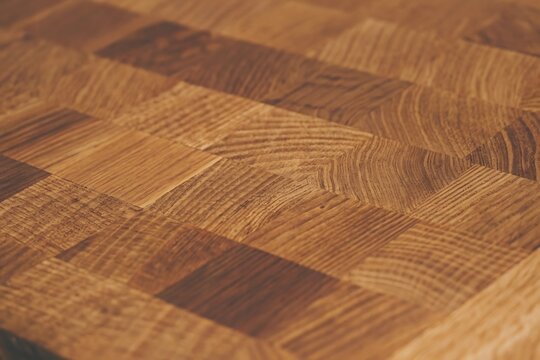 End grain oak wood texture background with natural brown timber pattern and rustic detail.