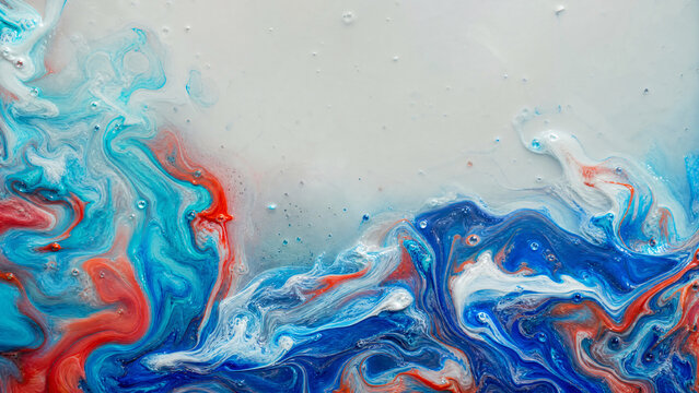 Oil paint swirling marbling pattern on water surface in vivid mixed colors from above