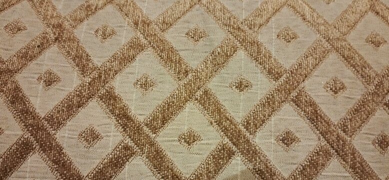Elegant beige geometric diamond patterned upholstery fabric. Featuring a textured trellis weave with tufted center dots, this premium neutral textile is perfect for luxury drapery, cushions, and elega