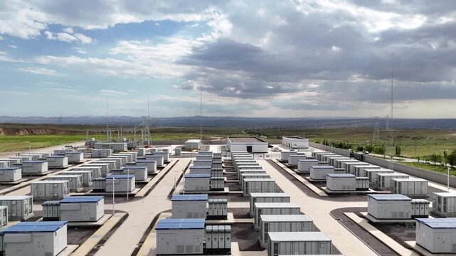 Large scale outdoor energy storage station container array under cloudy sky