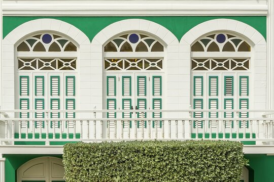 Oranjestad colorful building facade with arched windows