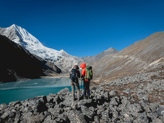 Fototapeta premium Backpacking hikers hiking on high altitude mountain top
