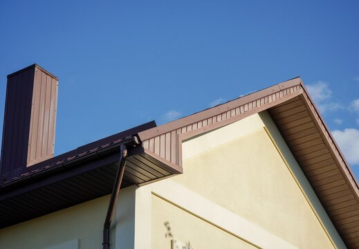 Detail of residential house roof with chimney and gutter system horizontal