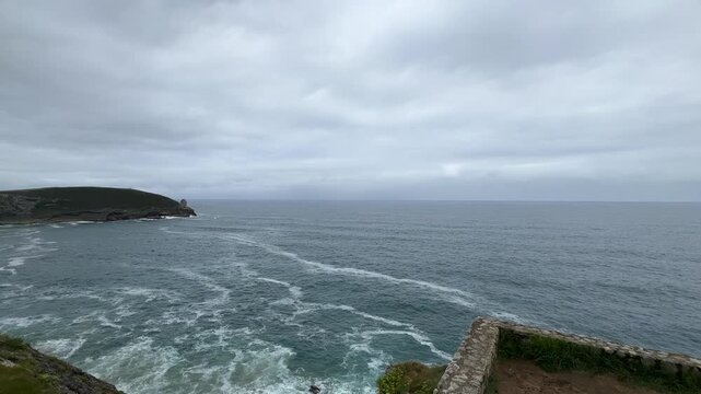 Seagulls Feeding Along the Rocky Coast of Llanes