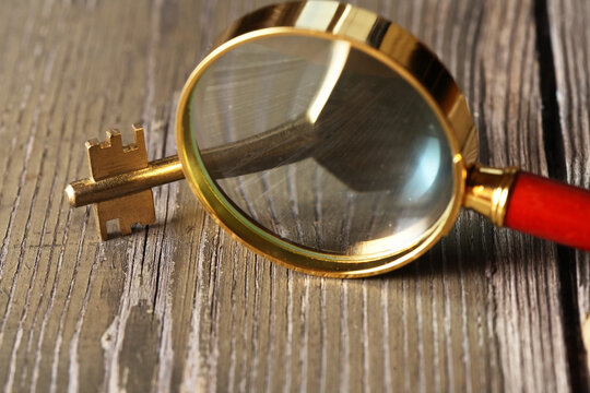 Magnifying Glass And Key