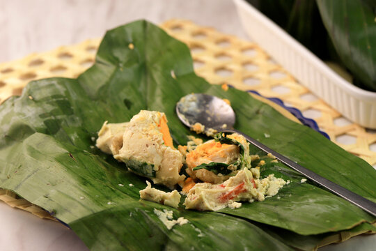 Pepes or Bothok Tahu Telur Asin is Indonesian Traditional Food From Tofu with Salt Egg.
