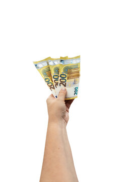 A stack of euro banknotes held in a hand, isolated against a plain background. A thick roll of euro banknotes.