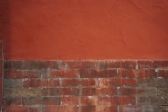 Red Plastered Wall with Brick Base Detail
