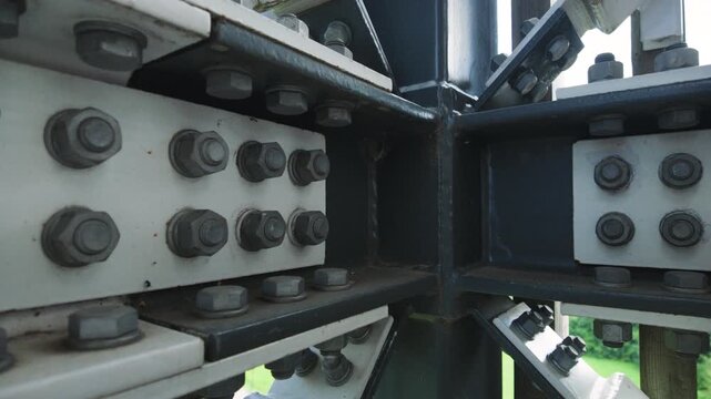 Close up of bolted steel beam joints on industrial construction