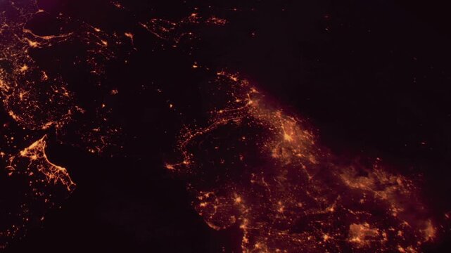 The view shows India at night from space with city lights shining brightly. The coastlines and major urban areas are visible, creating a beautiful light display in the dark.