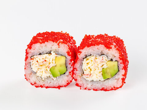 Sushi roll with red tobiko and avocado on white background