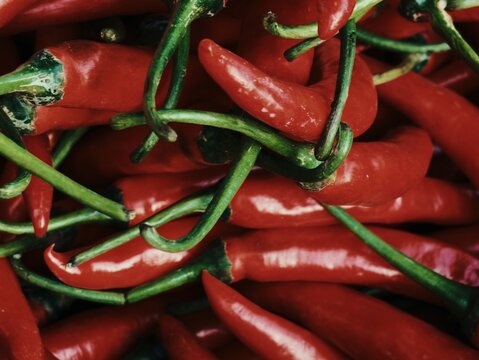 Close up full frame view of fresh large red chili peppers