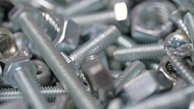 Metal bolts and nuts piled together
