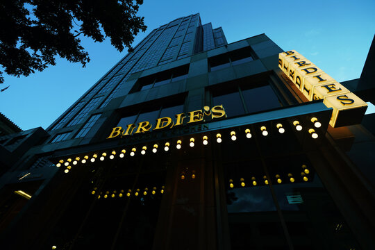 Raleigh, NC - USA - 6-23-2026: Birdie's restaurant on Fayetteville Street in downtown Raleigh at night