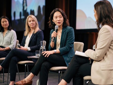 Generative AI, Asian businesswoman speaking on a panel discussion at a conference