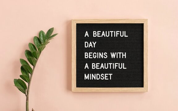 Black letter board with quote a day begins with a mindset