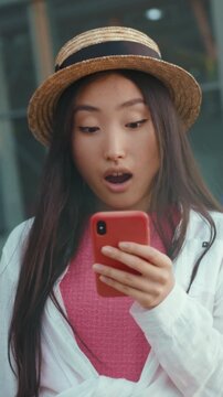 Unexpected sale sparks shopping excitement, Outdoor shopper reacts happily upon discovering special sale offer quickly