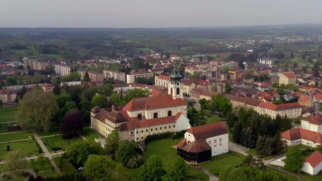Drone aerial of the Cistercian Abbey of Szentgotth&aacute;rd, Hungary, showcasing one of the country's finest Baroque monasteries and its magnificent church.