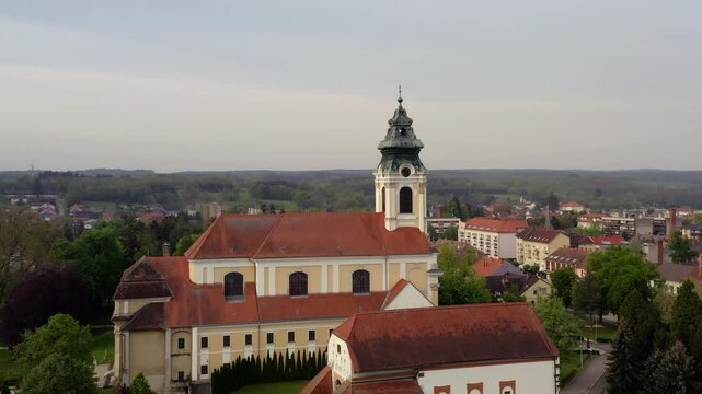 Drone aerial of the Cistercian Abbey of Szentgotth&aacute;rd, Hungary, showcasing one of the country's finest Baroque monasteries and its magnificent church.