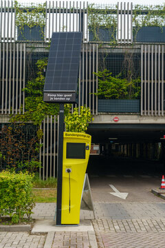 Wageningen, Gelderland, Netherlands - 03 May 2026: Eco friendly solar powered Smart Tire Pump Bandenpomp.nl at parking lot on Wageningen University campus