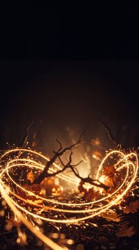Glowing Light Luminous Golden Sparkler Trails in Autumn Night Background for Seasonal Campaign