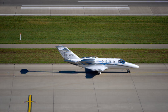 Private jet MPC Air type Cessna Citation M2 registration YU-MPC taxiing to runway at Swiss Z&uuml;rich Airport on a sunny summer day. Photo taken August 30th, 2026, Zurich Airport, Switzerland.