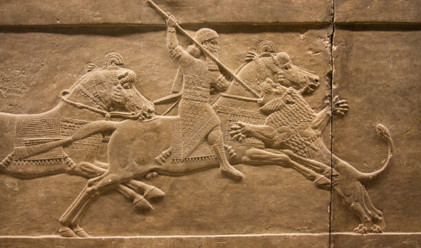 Ashurbanipal on horseback spearing a lion. Assyrian bas-relief. British Museum, London.