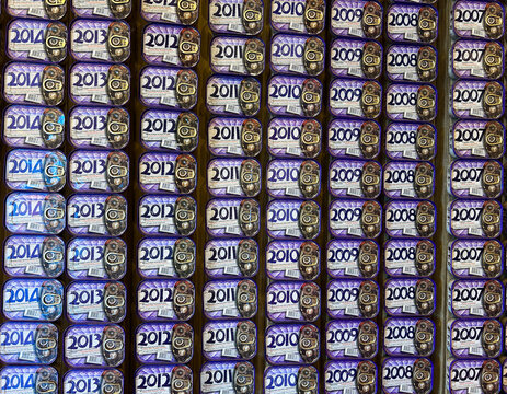 Collectible sardine cans, marked with different years, in the famous Portuguese store. Close-up. Porto. Portugal.