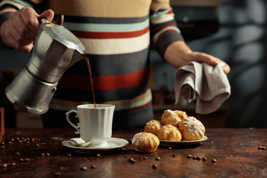 Profiteroles with mascarpone and cup of black coffee.