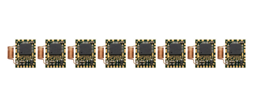 Microchip circuit board electronic module row with copper coil antenna isolated on white background for wireless RF technology, hardware engineering, IoT connectivity, and advanced electronic design.