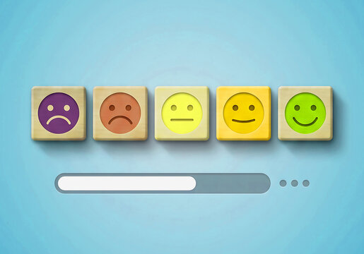 Wooden blocks with emotion icons representing customer feedback